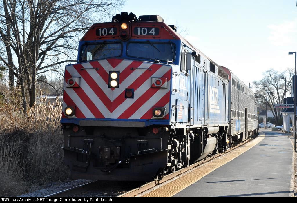 Outbound commuter approaches its station stop